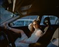 "My wife - Good news", from the Good News series, the artist partner in the artist NY driven taxi, from the Good News series, medium format film, 60x70 cm, 2021, photography by Daniela Groza - (c) Daniela Groza 2021